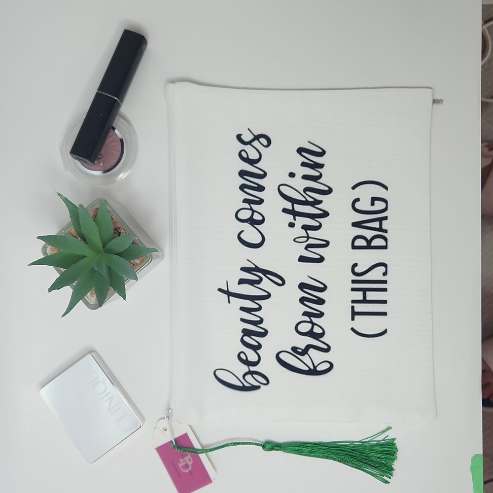 Canvas makeup bag with green tassel and printed design